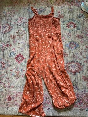 Maurices Rust Orange Floral Smocked Jumpsuit